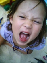 Top-down view of a toddler's best rock star scream-face.