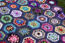 Crocheted hexagon-ed blanket of riotous color